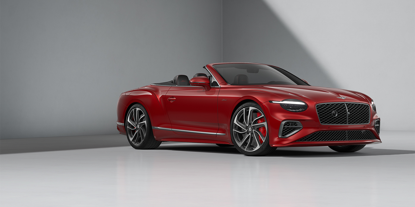 Bentley Köln Bentley Continental GTC Speed convertible in Dragon Red paint and 22" swept spoke wheels - front 3/4