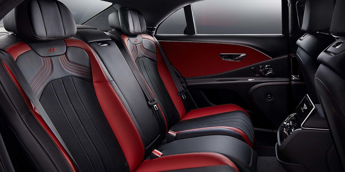 Bentley Köln Bentley Flying Spur S sedan rear interior in Beluga black and Hotspur red hide with S stitching