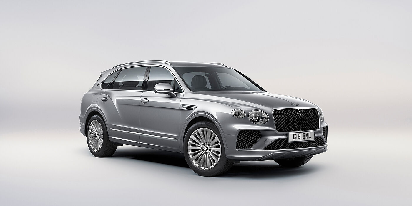 Bentley Köln Bentley Bentayga Extended Wheelbase luxury SUV front three quarter view in Moonbeam paint with 21 inch five spoke painted wheels