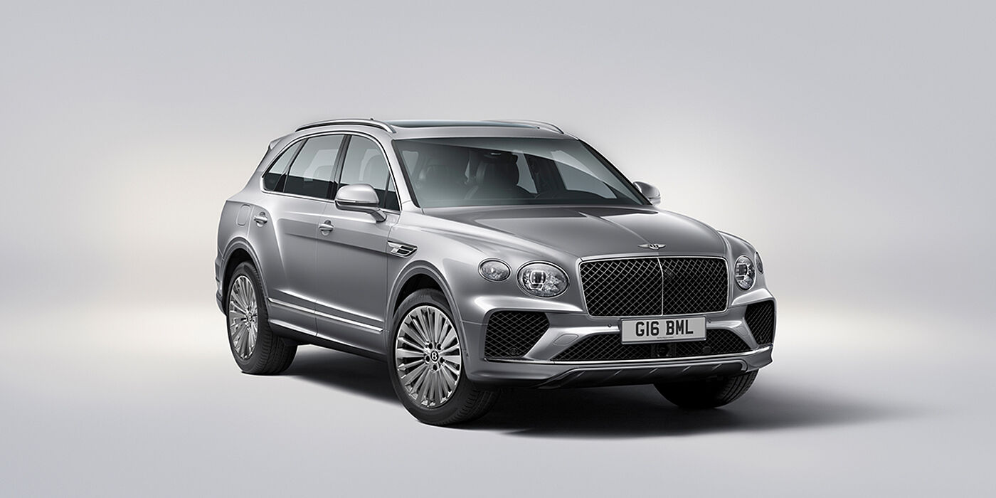 Bentley Köln Bentley Bentayga luxury SUV front three quarter view in Moonbeam paint with matrix grille and 21″ 5 spoke painted wheels