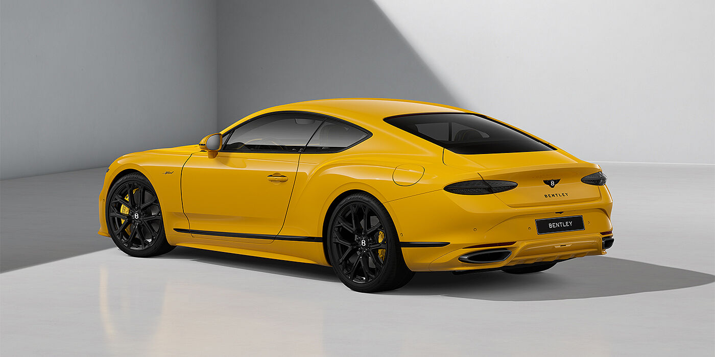 Bentley Köln Bentley Continental GT Speed coupe in Monaco Yellow paint and 22" Ten spoke sport wheels - rear 3/4