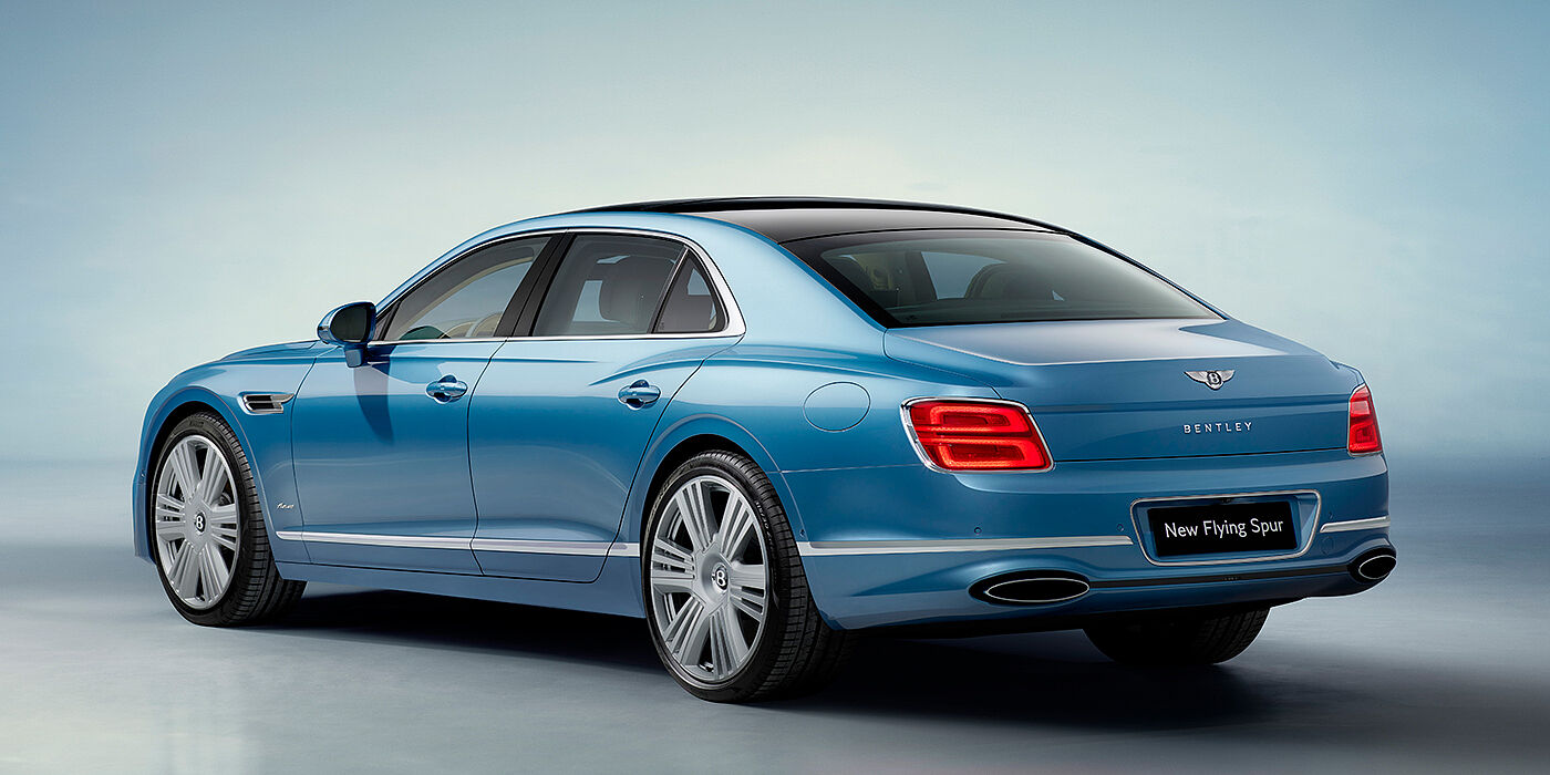 Bentley Köln New Bentley Flying Spur Azure sedan rear view in Light windsor blue by Mulliner paint with 22 inch Azure wheels and chrome exterior details
