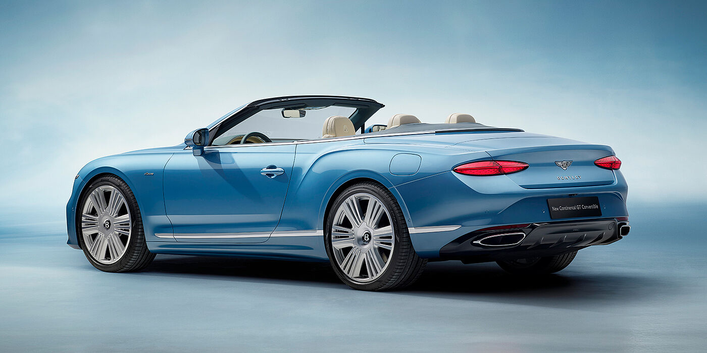 Bentley Köln New Bentley Continental GTC Azure convertible rear view in Light Windsor blue paint with 22 inch ten spoke wheels and chrome exterior details