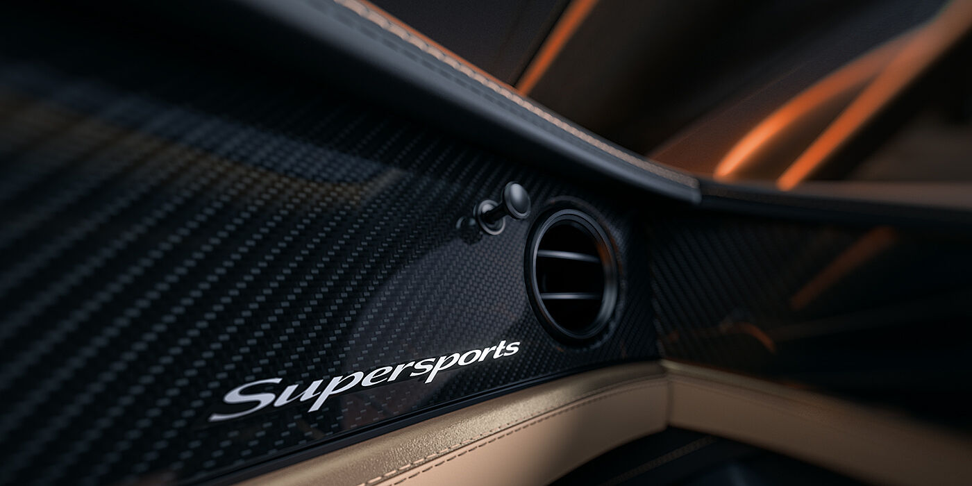 Bentley Köln Bentley Supersports front interior high gloss black carbon fibre veneer detail with Supersports badge