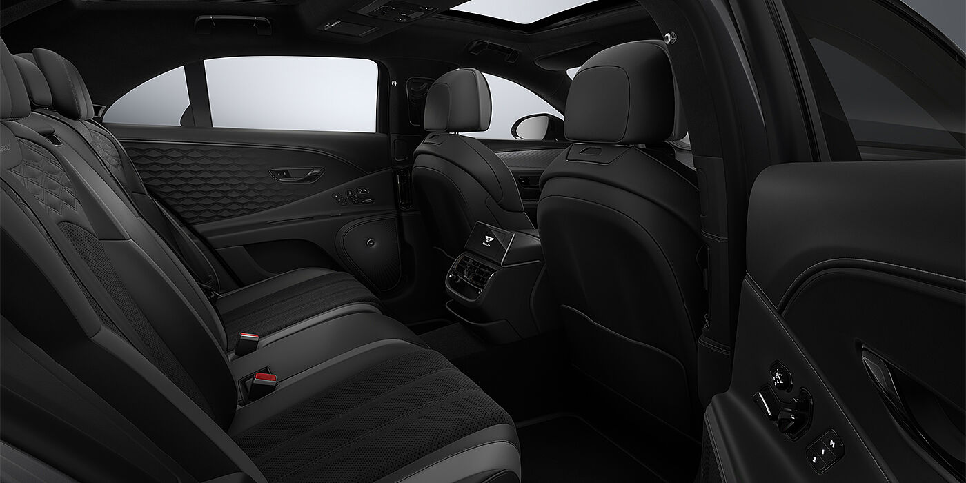 Bentley Köln New Bentley Flying Spur Speed sedan rear interior in Gravity Grey and Beluga Black hides with Diamond Brushed Dark Tint Aluminium veneer