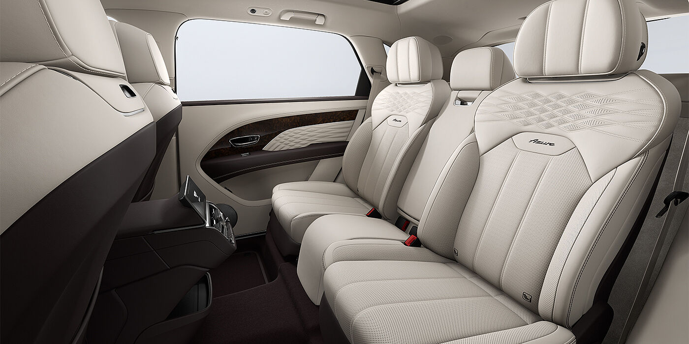 Bentley Köln Bentley Bentayga EWB Azure SUV rear interior in Linen and Burnt Oak hides and Azure seat stitching