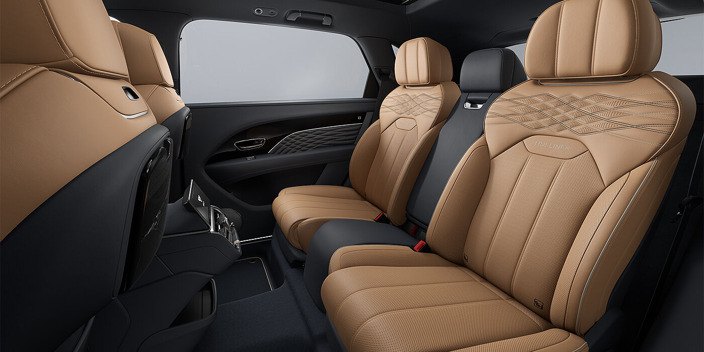 Bentley Köln Bentley Bentayga EWB Mulliner SUV rear interior in Camel and Brunel hides with Mulliner contrast stitching