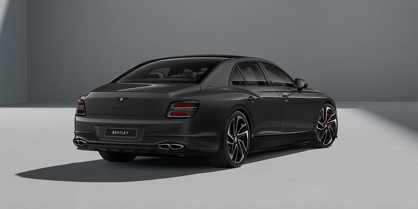 Bentley Köln New Bentley Flying Spur Speed sedan in Magnetic paint rear 3/4 with 22" Swept spoke Black & Machined wheels