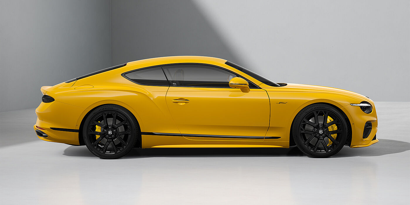 Bentley Köln Bentley Continental GT Speed coupe in Monaco Yellow paint and 22" Ten spoke sport wheels - profile