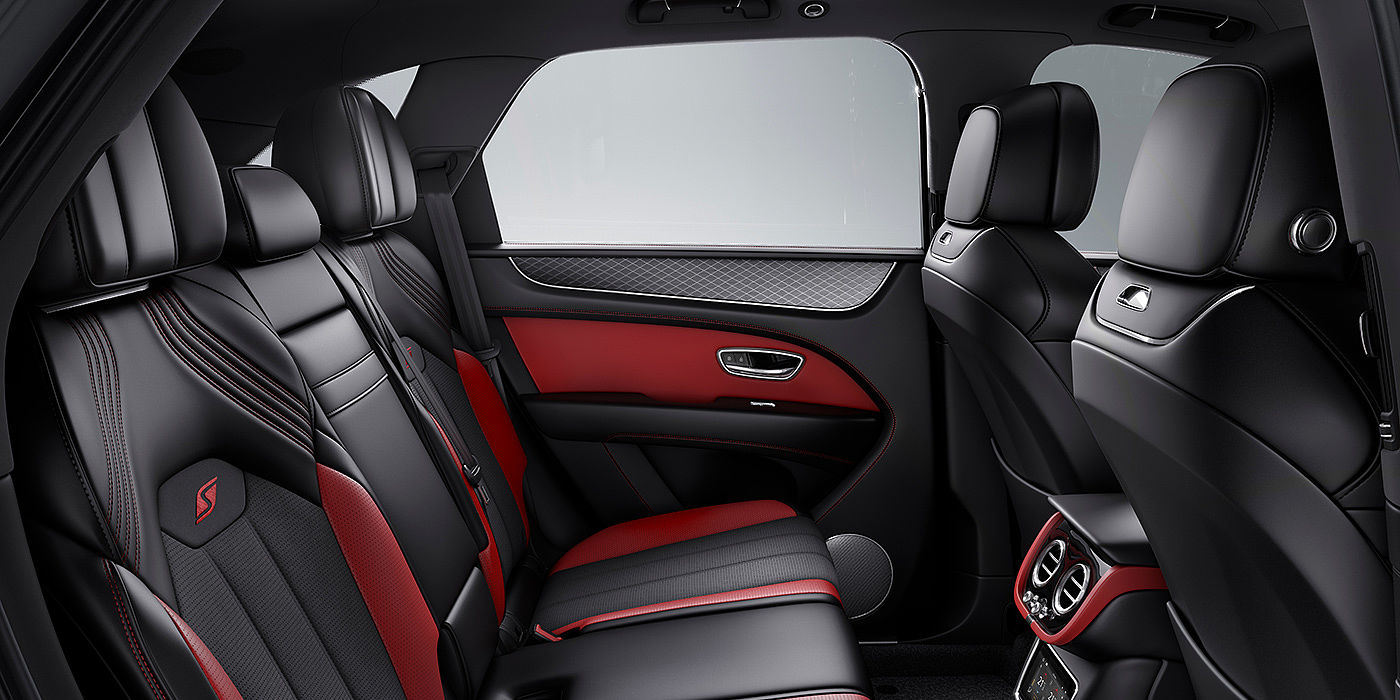 Bentley Köln Bentey Bentayga S interior view for rear passengers with Beluga black and Hotspur red coloured hide.