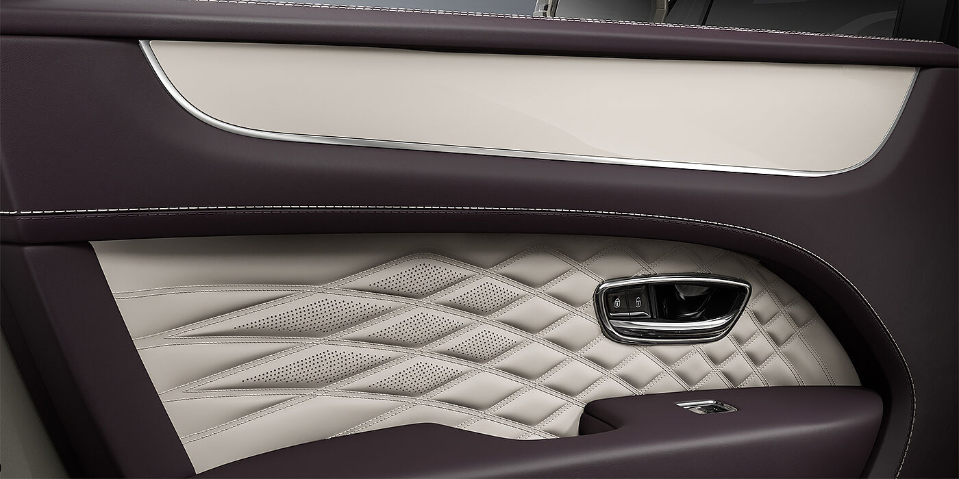 Bentley Köln Bentley Bentayga EWB Azure SUV door interior detail in Linen and Damson hides with Piano Linen veneer