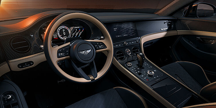 Bentley Köln Bentley Supersports front interior in Beluga and Camel hides with Bronze accents and high gloss black carbon fibre veneer.