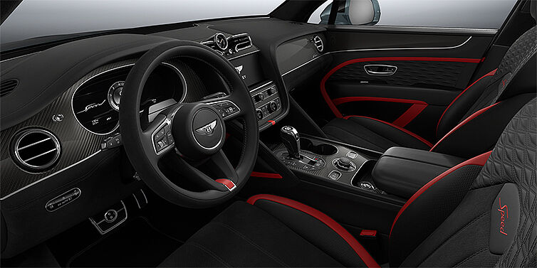Bentley Köln Bentley Bentayga Speed SUV front interior in Pillar Box Red and Beluga black hides with Carbon Fibre veneer