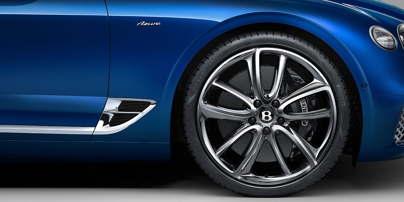 Bentley Köln Bentley Continental GTC Azure convertible in Sequin Blue paint side profile with Azure badge close up