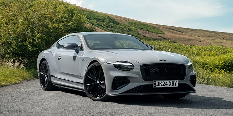Bentley Köln Bentley Continental GT front three quarter with Carbon Fibre Specification parked on road.