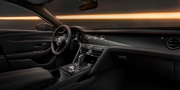 Bentley Köln Bentley Flying Spur Black Edition sedan front interior in Beluga black hide with High Gloss Carbon Fibre veneer