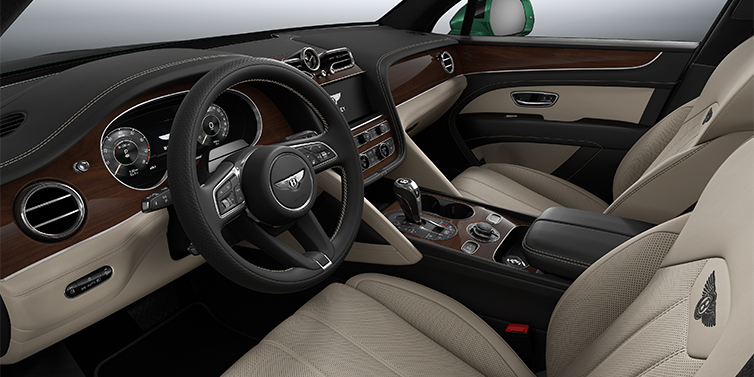 Bentley Köln Bentley Bentayga SUV front interior in Portland and Beluga black hides with Crown Cut Walnut veneer
