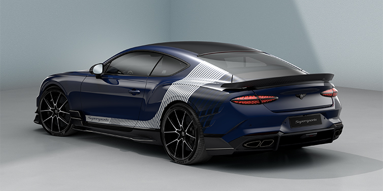 Bentley Köln Bentley Supersports rear three quarter in "Skies" Design theme with Electric Blue paint finish and Arctica white and Oxford blue paint stripes across the rear haunch.