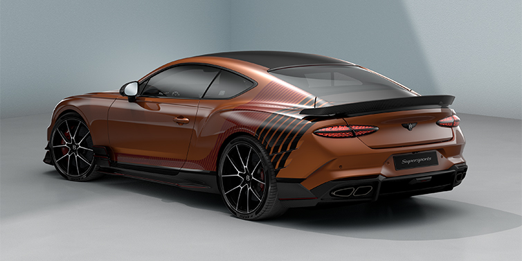 Bentley Köln Bentley Supersports rear three quarter in "Meteorite" Design theme with Orange Flame paint and Beluga Black and Candy Red paint stripes across the rear haunch.