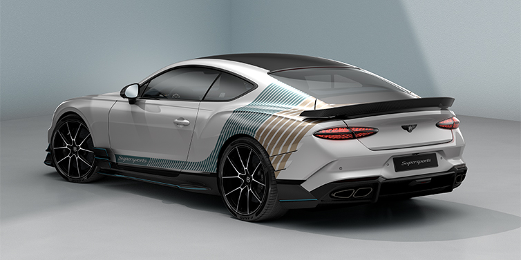 Bentley Köln Bentley Supersports rear three quarter in "Snowstorm" Design theme with Snow Quartz paint and Topaz blue and Camel brown paint stripes across the rear haunch.