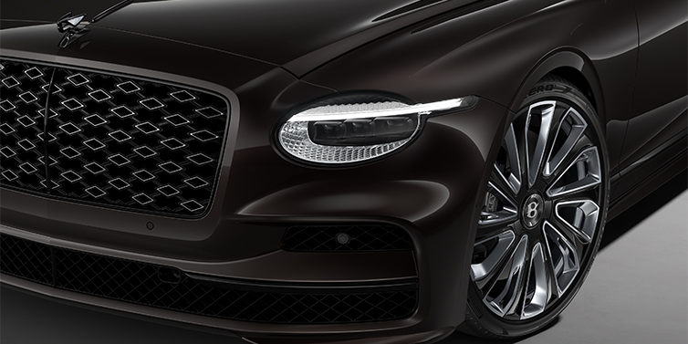 Bentley Köln New Bentley Flying Spur Mulliner sedan head lamp against Havana brown paint with  22" Mulliner Black Painted & Polished wheel