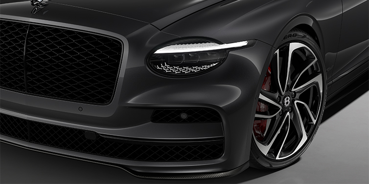 Bentley Köln New Bentley Flying Spur Speed sedan head lamp against Magnetic paint with 22" Swept spoke Black & Machined wheel