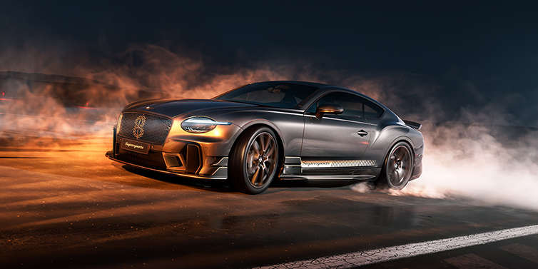 Bentley Köln Bentley Supersports front three quarter in "Nightfall" Design theme with Anthracite paint, Camel accents and Camel and Beluga black striping standing on mist covered concrete