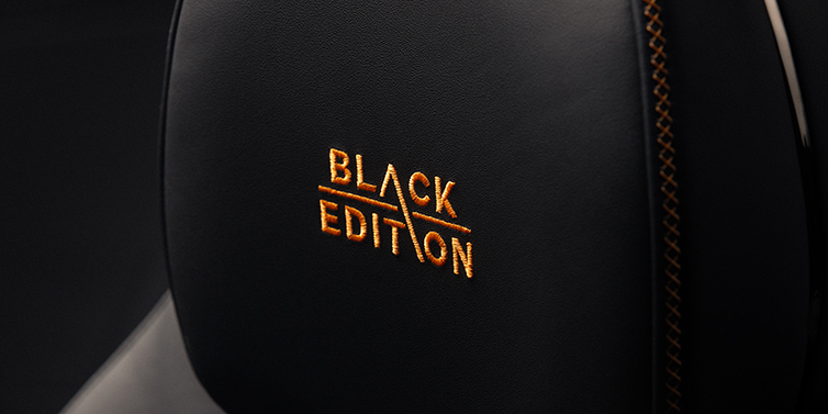 Bentley Köln Bentley Continental GT coupe seat headrest Black Edition stitched emblem in Mandarin colour against Beluga black hide