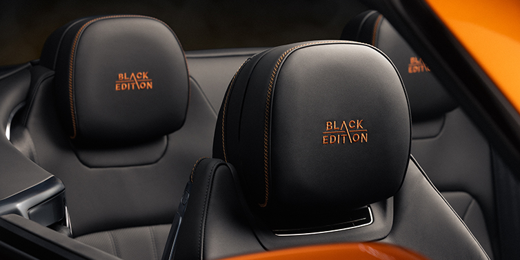 Bentley Köln Bentley Continental GTC Black Edition convertible seat detail with Beluga black hide and Mandarin emblem stitching